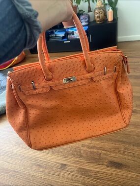 Penelope Ann tangerine handbag